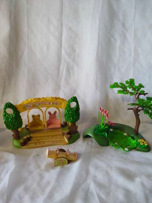 Big lot of original Sylvanian families furniture and outside playset