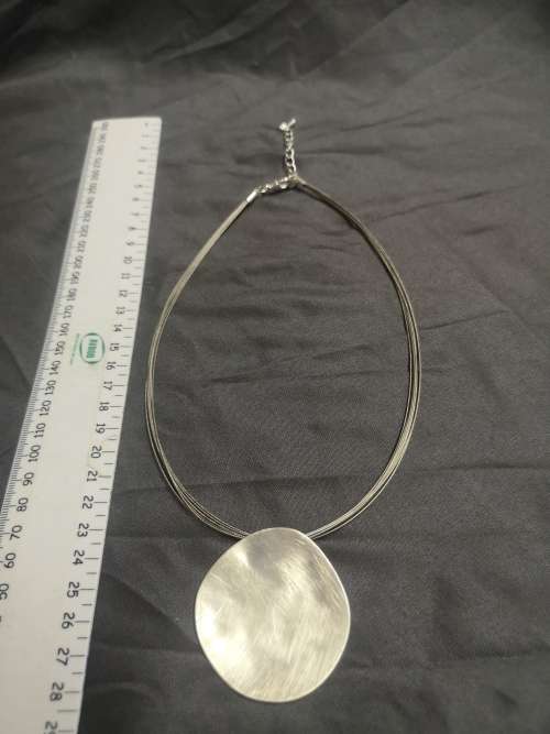 Stunning silver tone necklace with large pendant