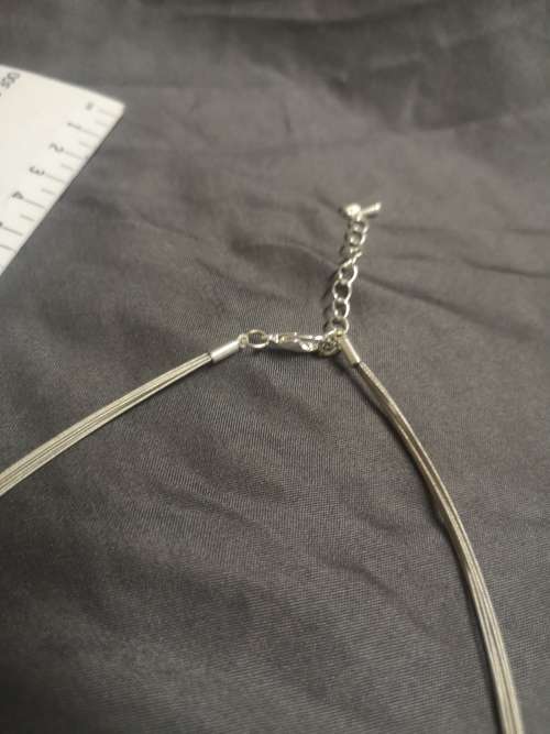 Stunning silver tone necklace with large pendant