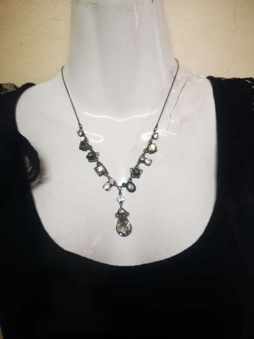 Lovely charm necklace on auction