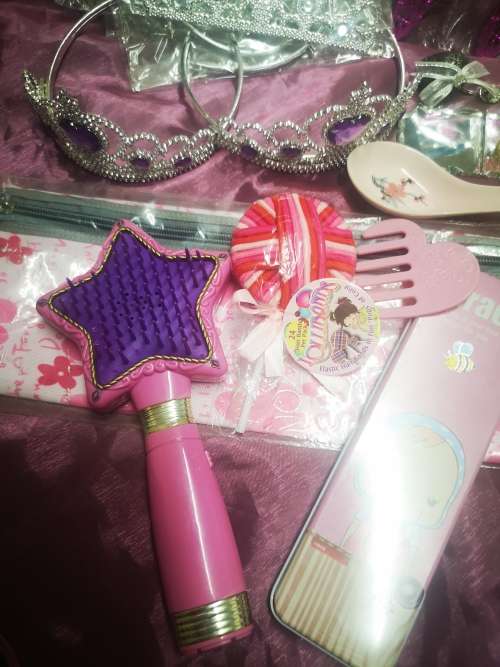 Big lot of girly goodies, includes tiaras, pink swords, pencil bag (never used) and more...