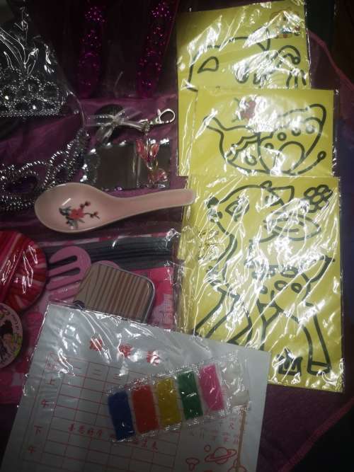 Big lot of girly goodies, includes tiaras, pink swords, pencil bag (never used) and more...