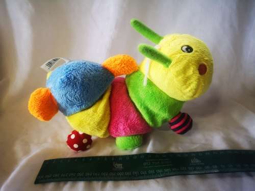 A beautiful and colorful caterpillar soft toy - perfect baby toy!