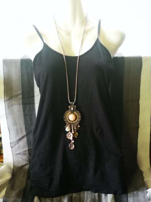 Beautiful necklace with bulky pendant and charms