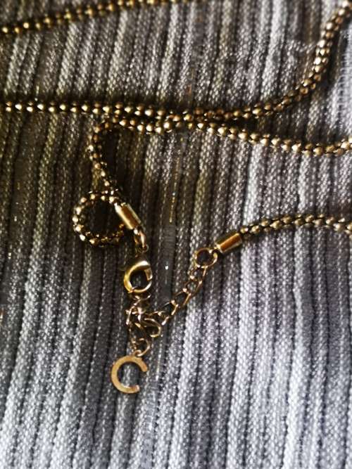 Beautiful necklace with bulky pendant and charms