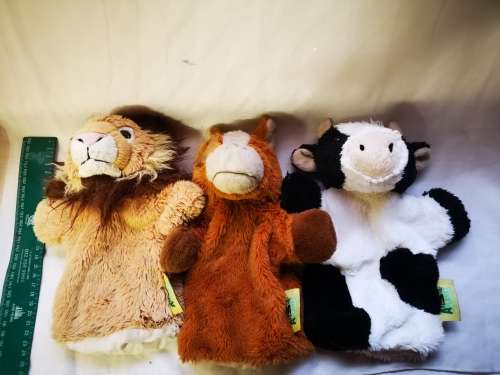 Three "animal planet" hand puppets on auction