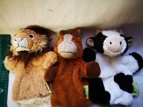 Three "animal planet" hand puppets on auction
