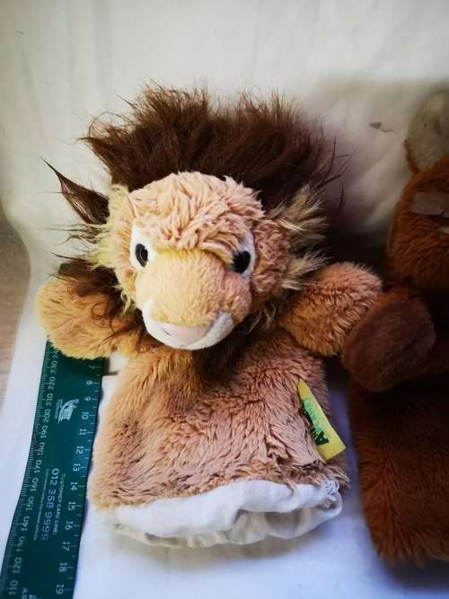 Three "animal planet" hand puppets on auction