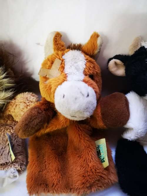 Three "animal planet" hand puppets on auction