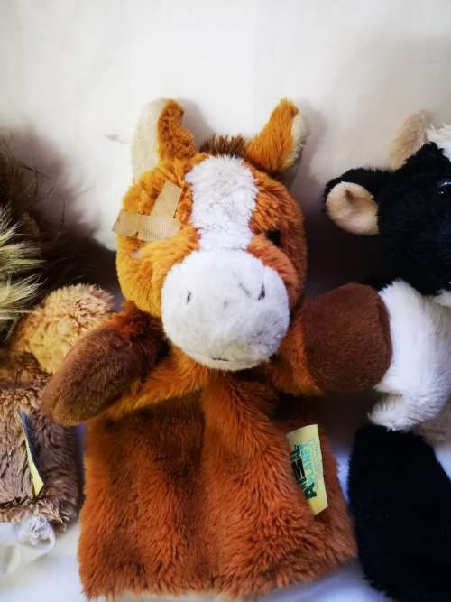 Three "animal planet" hand puppets on auction