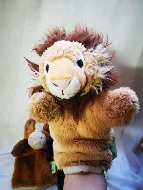 Three "animal planet" hand puppets on auction