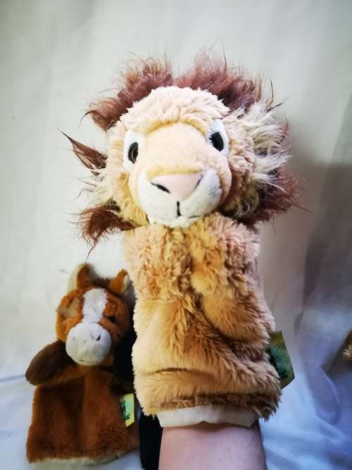 Three "animal planet" hand puppets on auction