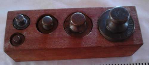 Antique 19 th century Brass scale weights in wooden holder