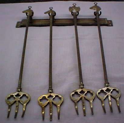 Set of 4 Toaster forks  and wall hanger