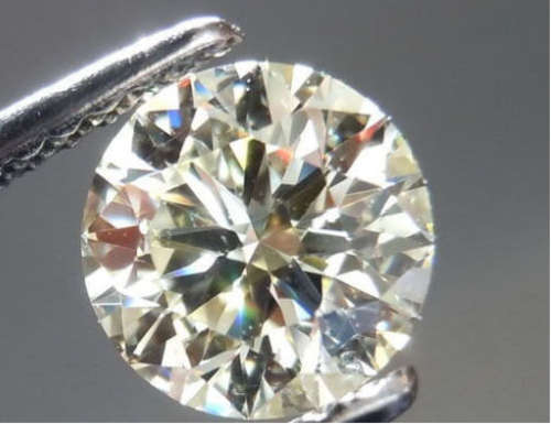 0.73 ct 6.25 mm Fiery Off White Round