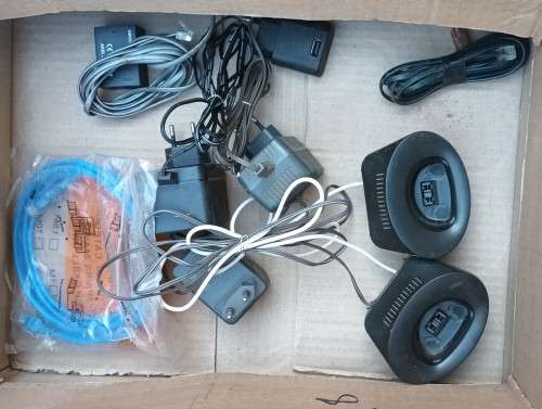 Box of electronics 2xRouters, wireless phones, hand cam,  CPU, cooling pad wires and so on