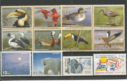 MIXED WORLD UN MOUNTED MINT SETS & PART SETS