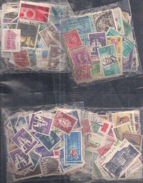MIXED WORLD USED LOT IN PKTS SOME DOUBLES