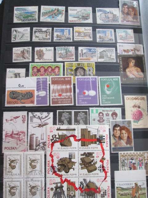PAGE OF PREVIOUSLY HINGED STAMPS-PORTUGAL/POLAND/GREAT BRITAIN/