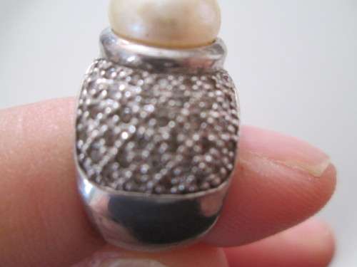 VERY PRETTY STERLING SILVER RING WITH PEARL AND DIAMONDS OR CUBICSECONIA NOT SURE