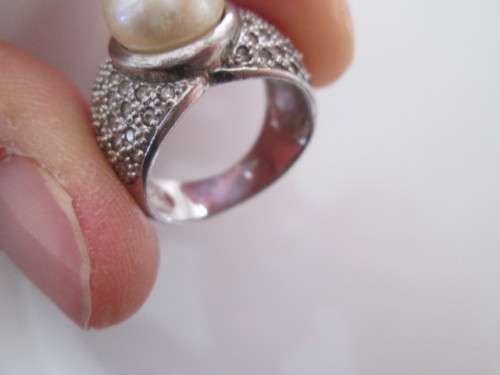 VERY PRETTY STERLING SILVER RING WITH PEARL AND DIAMONDS OR CUBICSECONIA NOT SURE