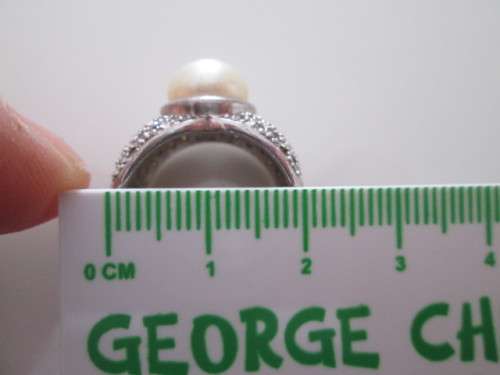 VERY PRETTY STERLING SILVER RING WITH PEARL AND DIAMONDS OR CUBICSECONIA NOT SURE