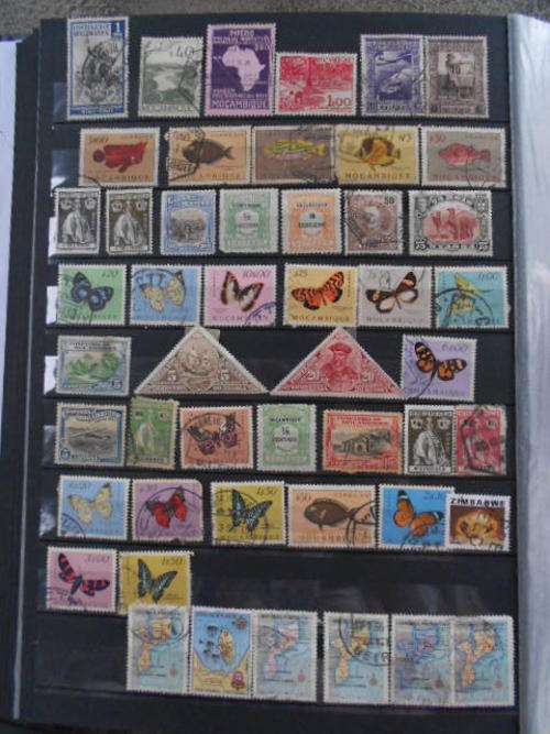 Old Rhodesia and Mozambique stamps previously hinged 2 dameged stamps