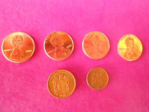 Uncirculated 1c pieces of the USA 2009  and used 1c and 2c from SA see more below