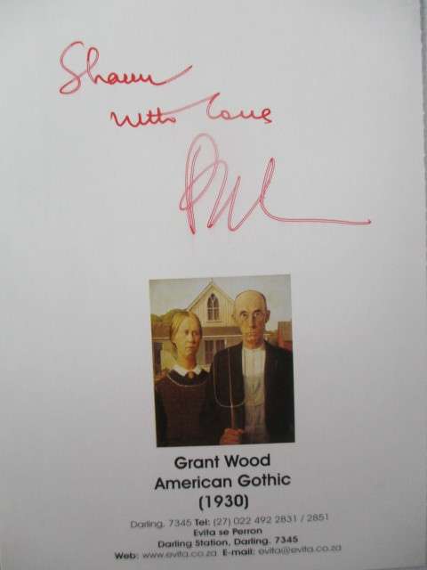 AUTOGRAPHED / SIGNED - PIETER DIRK UYS AS EVITA  SIGED CARD