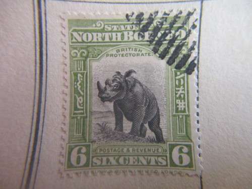 BORNEO / IRAN -  2 USED MOUNTED STAMPS
