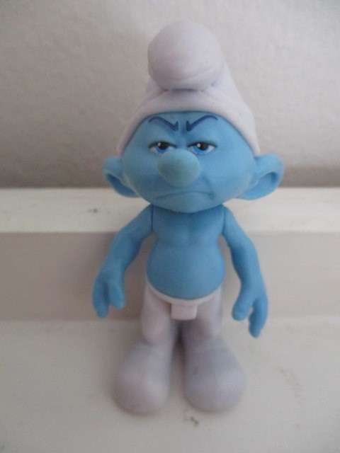 SMURF FIGUIRINE - GRUMPY - SMURF HAS SERIAL NUMBER UNDER FOOT ARMS AND LEGS MOVEABLE
