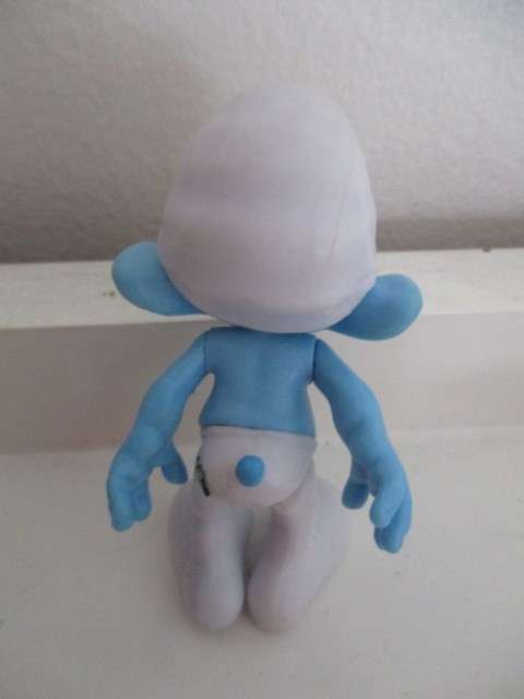 SMURF FIGUIRINE - GRUMPY - SMURF HAS SERIAL NUMBER UNDER FOOT ARMS AND LEGS MOVEABLE
