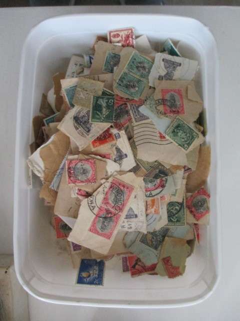 STAMPS  -  TWO LITRE ICE CREAM CONTAINER  FILLED WITH STAMPS
