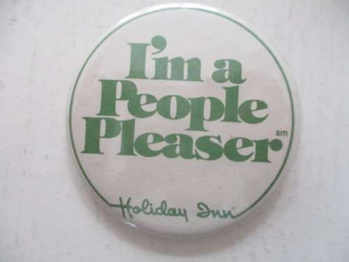 VINTAGE HOLIDAY INN METAL BADGE