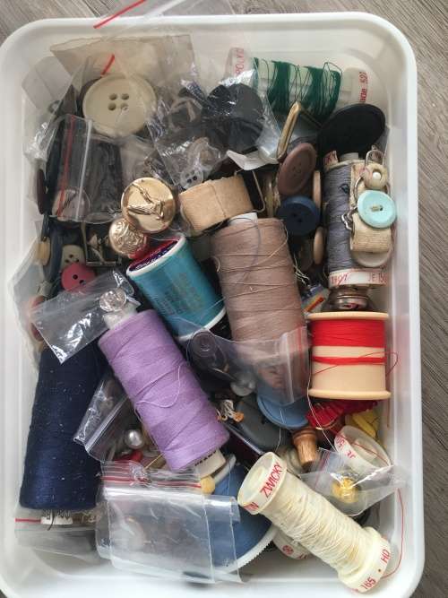 TWO LITRE ICE CREAM CONTAINER FULL OF BUTTONS COTTONS BUCKLES ETC