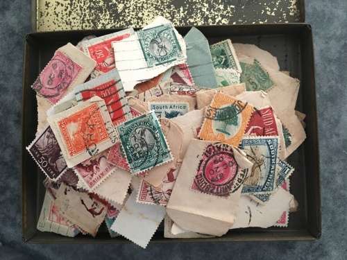 STAMPS VINTAGE CIGAR TIN FILLED WITH  UNCHECKED STAMPS