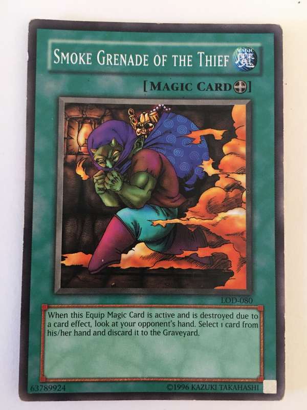 YU-GI-OH TRADING CARD - SMOKE GRENADE OF THE THIEF
