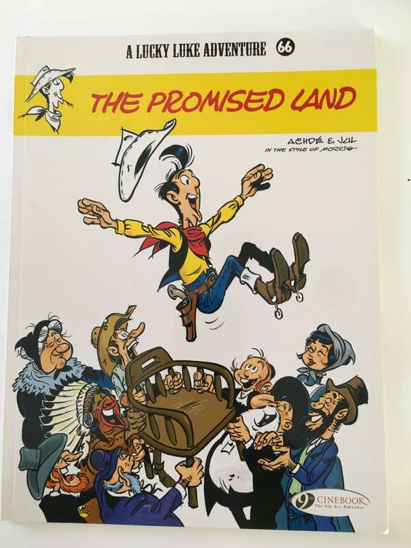 A LUCKY LUKE ADVENTURE - THE PROMISED LAND PAPER BACK 2017  - AS NEW