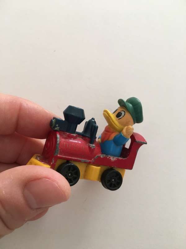 VINTAGE TOMY DIE CAST TRAIN WITH DUCK 1970`S AND PVC FIGURE
