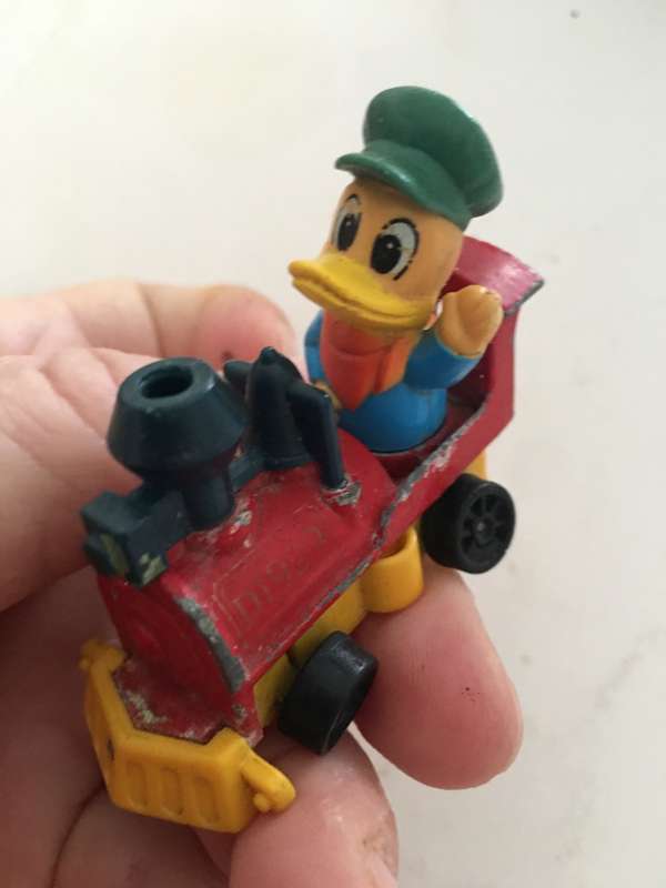 VINTAGE TOMY DIE CAST TRAIN WITH DUCK 1970`S AND PVC FIGURE