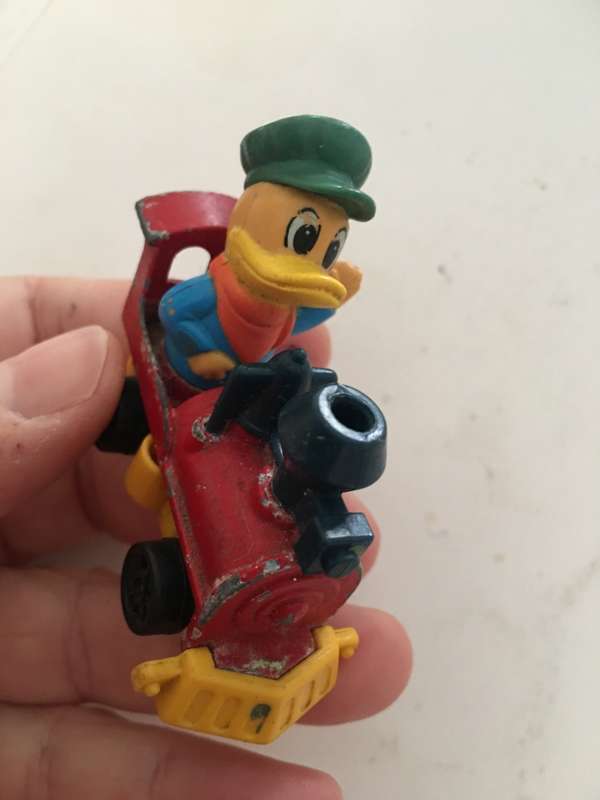 VINTAGE TOMY DIE CAST TRAIN WITH DUCK 1970`S AND PVC FIGURE