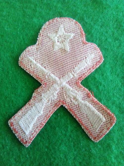 SADF .. SCHOOL CADET MARKSMAN BADGE .. EMBROIDED ON RED