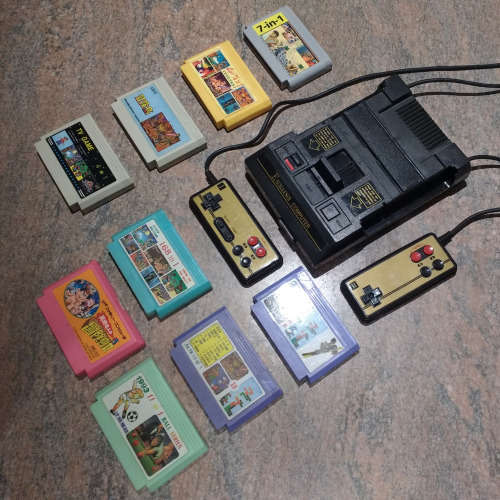 Nintendo 8-bit TV game console with cartridges