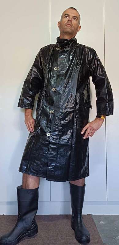 Vintage 1975 shiny black raincoat with metal clasp closure