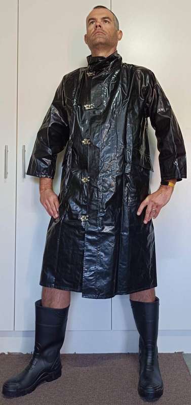 Vintage 1975 shiny black raincoat with metal clasp closure