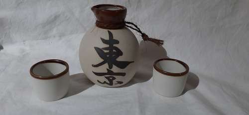 ** Japanese 20th Century Ceramic Sake Decanter and Two Cups (13cm). **