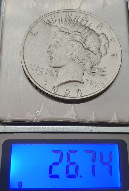 ** 1923 United States of America .900 Silver Peace Dollar (XF / VF) .**