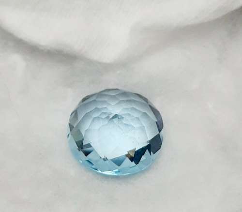 **STUNNING: 12.98 carat `Sky Blue` Natural Oval Cut Topaz w/ Certification.**