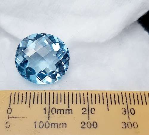 **STUNNING: 12.98 carat `Sky Blue` Natural Oval Cut Topaz w/ Certification.**
