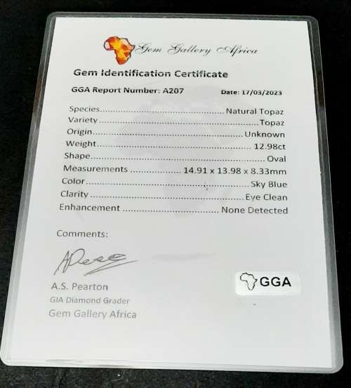 **STUNNING: 12.98 carat `Sky Blue` Natural Oval Cut Topaz w/ Certification.**